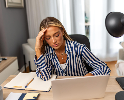 Stressed Woman Working From Home Office Environment
