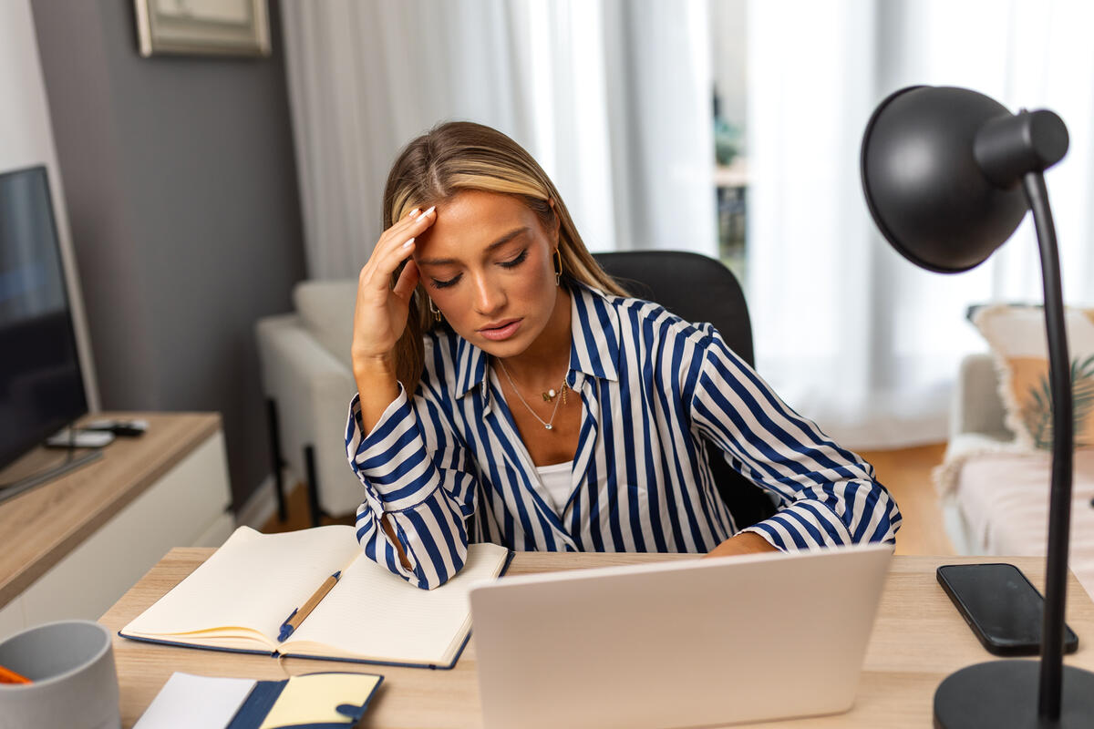 Stressed Woman Working From Home Office Environment