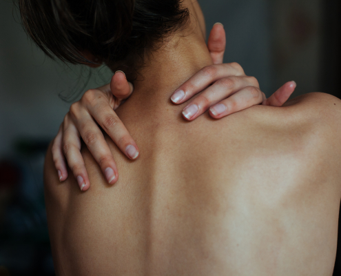 Person experiencing extreme pain relief using an acupressure mat at home