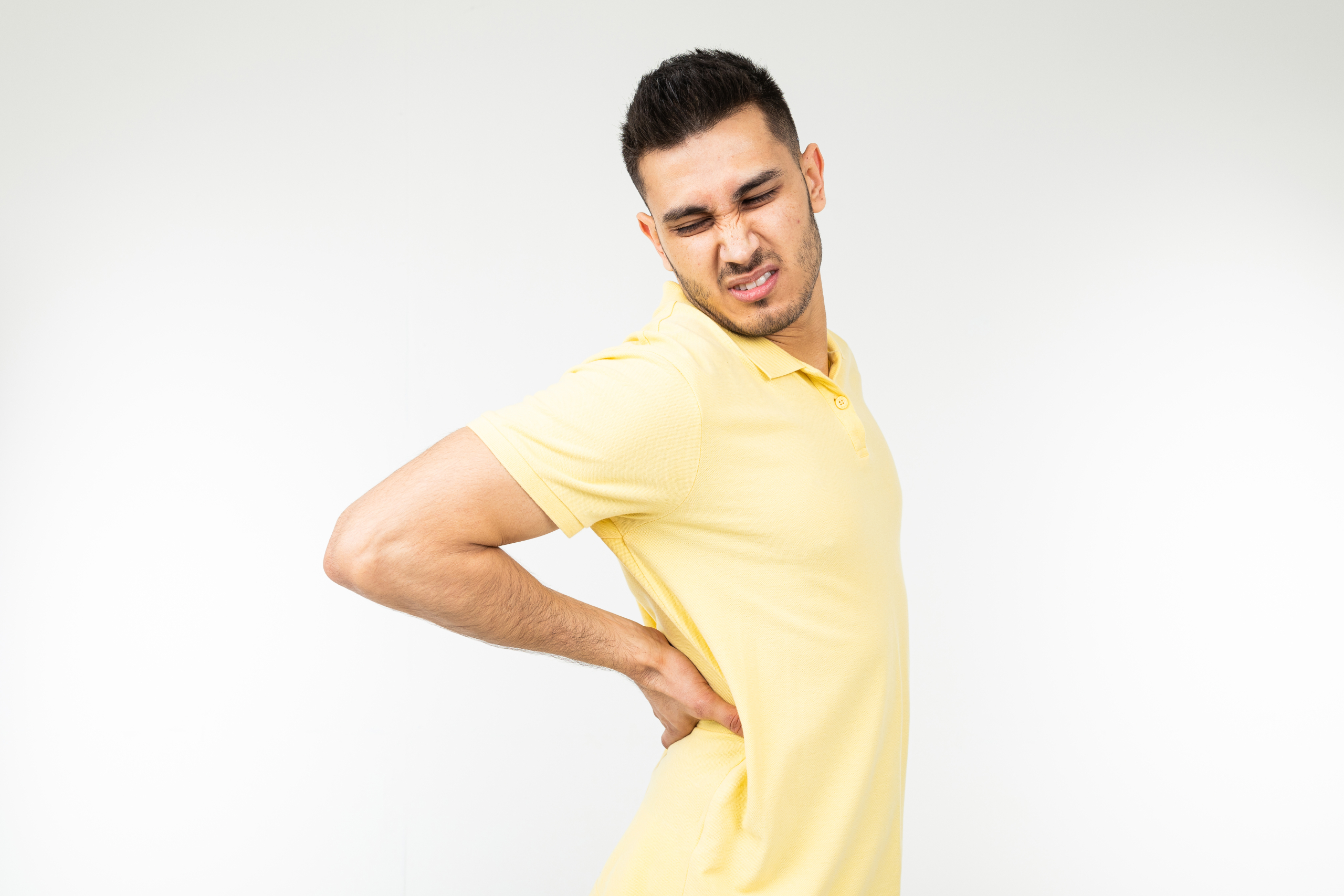 vecteezy brunette man pulled back muscle on a white studio background 70935289