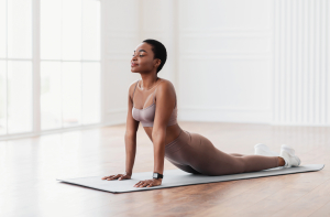 vecteezy relief lower back pain smiling black woman doing sphinx 65937689