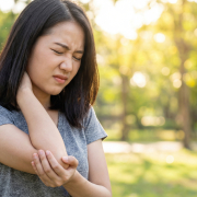 vecteezy young asian woman experiencing neck and arm pain outdoors 76981340