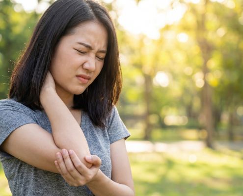 vecteezy young asian woman experiencing neck and arm pain outdoors 76981340
