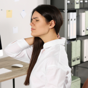 young woman experiencing neck tension relief after office work