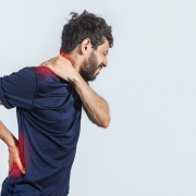 Adult waking with morning back pain who could benefit from using a lumbar pillow for sleeping each night