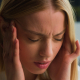 a woman having headache and opting for headache relief