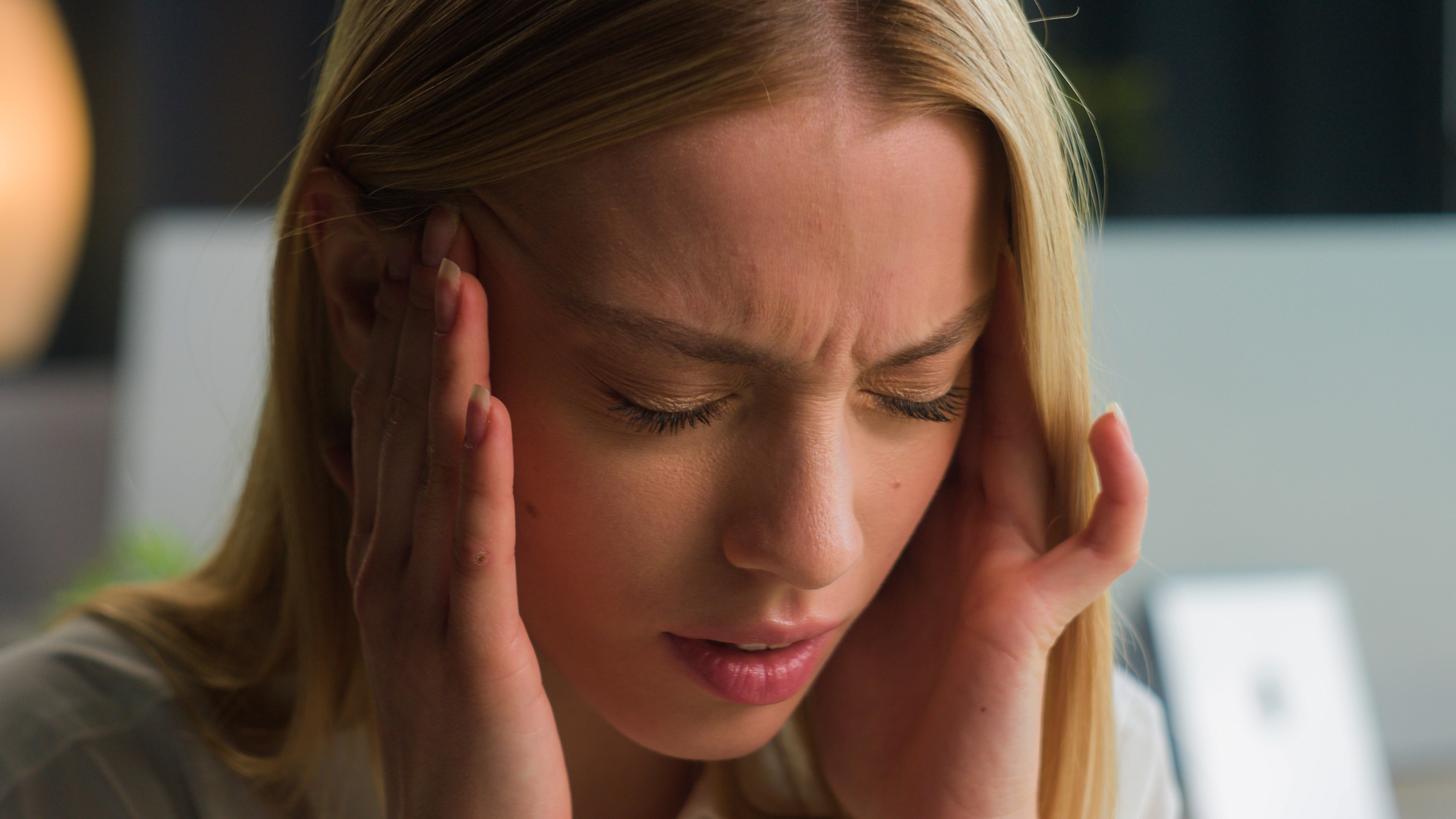 a woman having headache and opting for headache relief