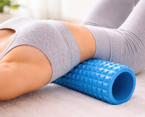woman using foam roller for back pain relief at home