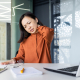 Office worker with stiff neck exploring the heated neck stretcher benefits