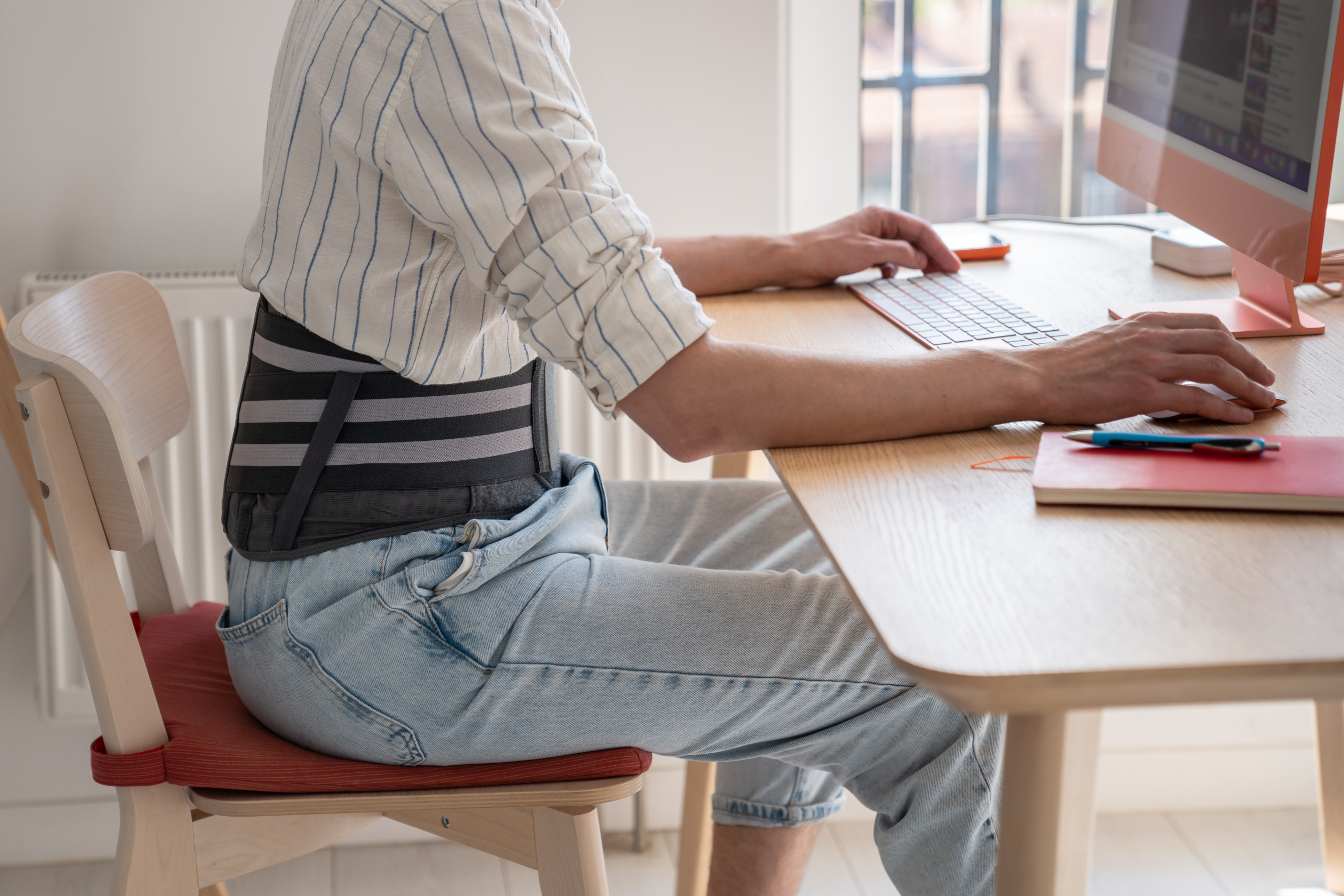 vecteezy man works on computer wears posture support belt on lower back 73252509