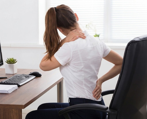 Remote worker experiencing back tension